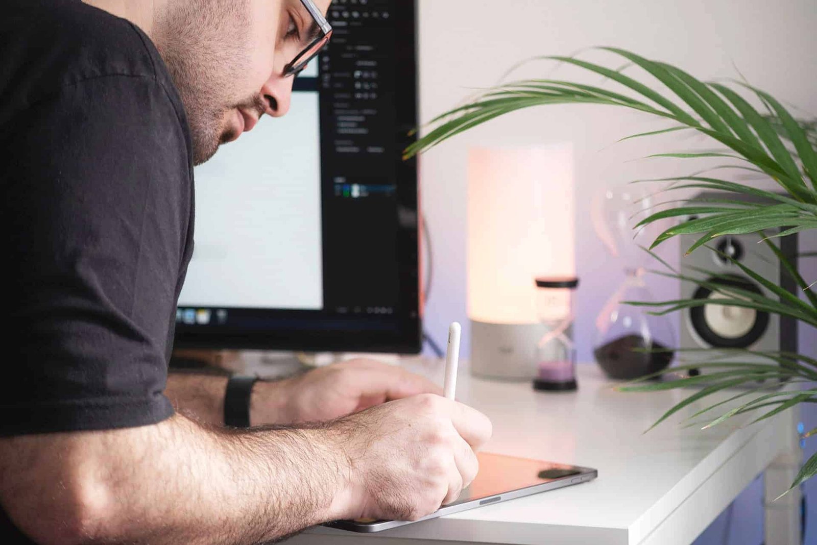 Designer working on a WordPress website design at a studio desk
